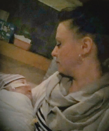 Eric's Heroes: Ollie's Family, mother holding baby