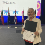 Gretchen Carrougher receiving Baskent award